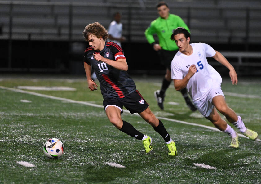 Mount Sis Zach Ramsey, left, controls the ball in an April 12 match against Bothell. Photos courtesy of Calder Productions