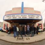 The thirteenth annual North Bend Jazz Walk was held April 27. Nineteen venues throughout downtown North Bend hosted 28 jazz bands with at least 100 total musicians from 5 p.m. to midnight. Learn more at northbendjazzwalk.com. Pictured: Excited guests hide from the rain under the cover of the North Bend Theatre. Photos by Ben Magnus/For the Valley Record