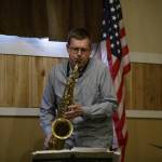 Josh Cook, part of the Jerry Steinhilber Trio, having a good time with his saxophone while preforming at The Moose Lodge.