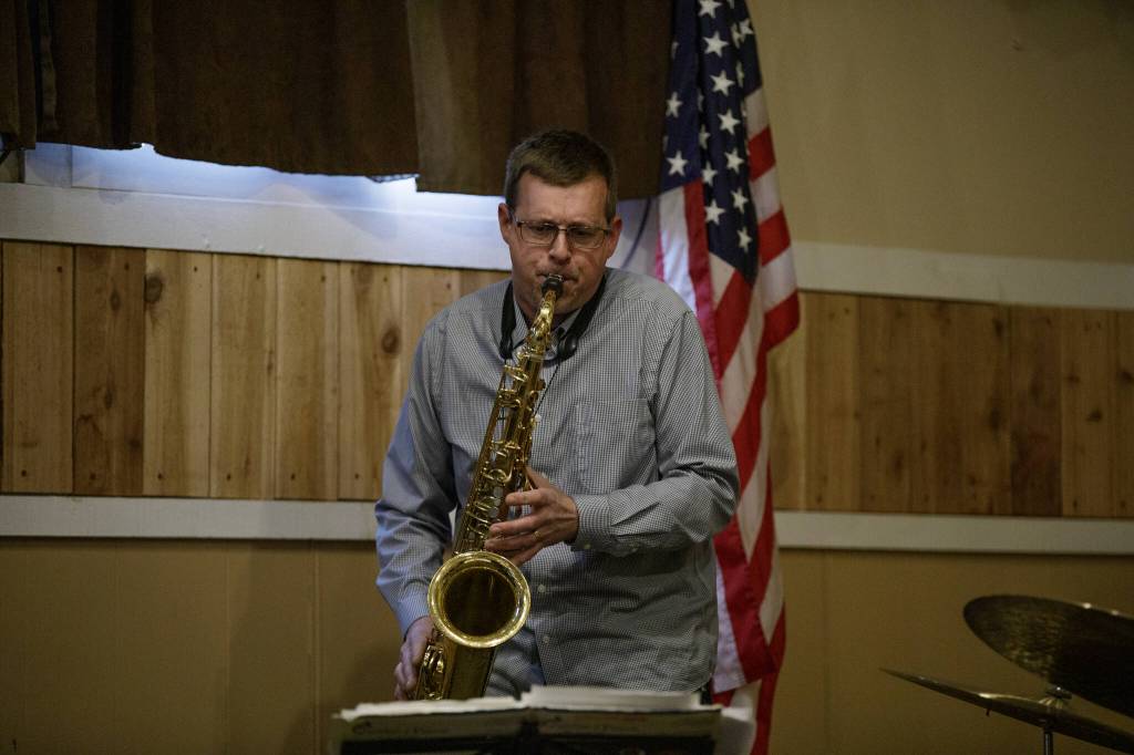 Josh Cook, part of the Jerry Steinhilber Trio, having a good time with his saxophone while preforming at The Moose Lodge.