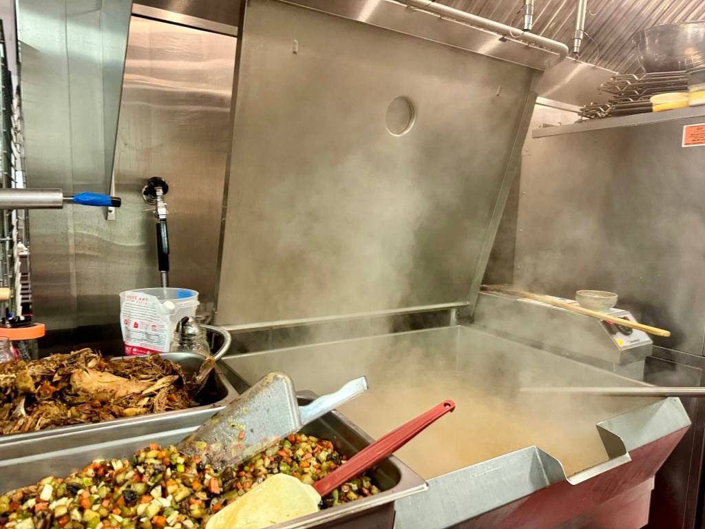 Chicken stock made by Sous Chef Kristin Baerg simmers in a tilt skillet in the Carnation Farms kitchen on March 28, 2024. The stock was made with the farms own chickens. Photos by Grace Gorenflo/For the Valley Record