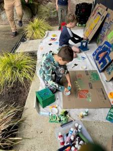 Troop 425 Scouts painting bird houses and feeders for the Fall City Art Park. (Photo courtesy of Kyle Sundet)