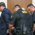 Auburn Police Officer Jeffrey Nelson is escorted out of the courtroom following the guilty verdict at his murder trial June 27, 2024. (Ken Lambert / The Seattle Times / Pool)