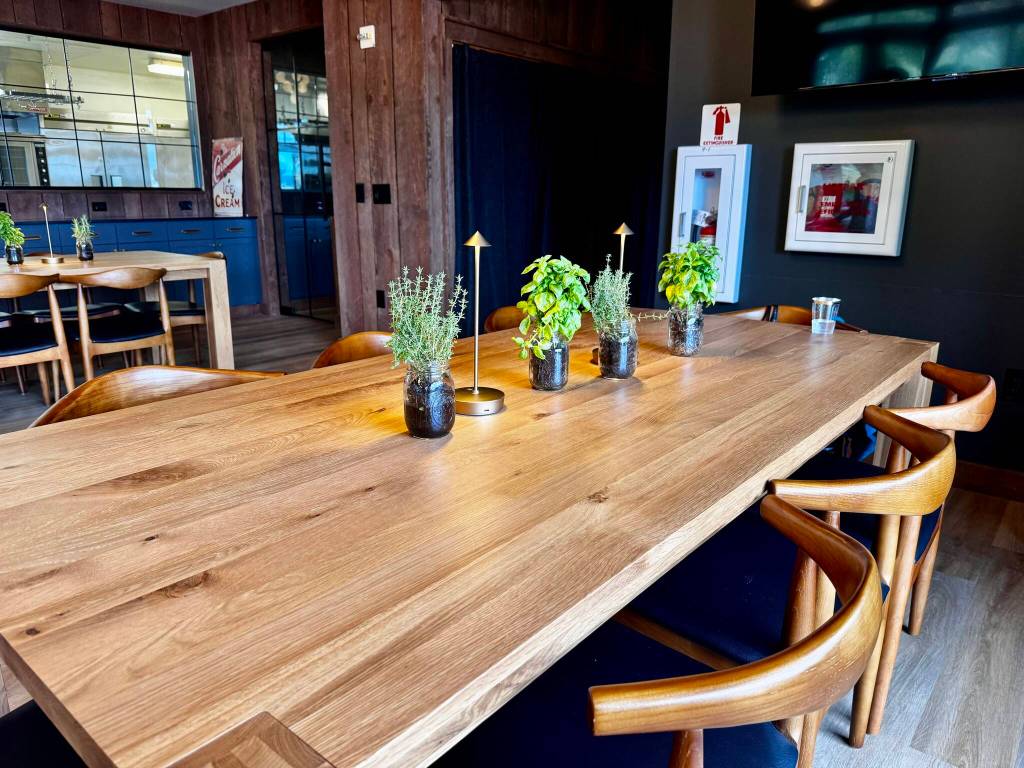 A dining table is decorated with herbs and lamps at the soft opening of Carnation Farmss Farmview Kitchen Aug. 14, 2024. Photos by Grace Gorenflo/For the Valley Record