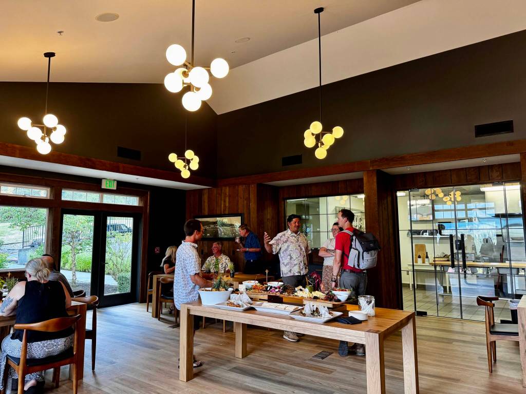 Carnation Farms staff members gather with their family and friends at the Farmview Kitchens soft opening Aug. 14, 2024. Photo by Grace Gorenflo/For the Valley Record