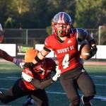 Mount Si ball carrier breaks a tackle at the Charlie Kinnune Scarlet and Gray Game. Photos by Ben Ray / The Record