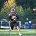 Mount Si quarterback rolls outside the pocket during a simulated drill. Ben Ray / Valley Record