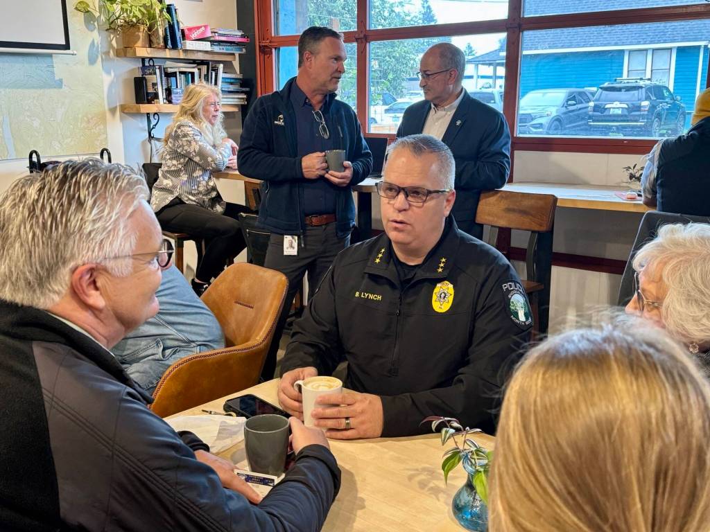 Photos courtesy of the city of North Bend
Snoqualmie Police Chief Brian Lynch speaks with community members at a Sept. 17 Chat with the Chief event at Arete Coffee Bar in North Bend.