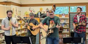 The North Bend Library celebrated its 30th anniversary on Sept. 14 from 11 a.m. to 4 p.m. with cake, cherry pie and coffee from Trail Youth Coffee. Tinkham Road, 425 Magazines favorite local band, also performed at the event. (Photo courtesy of the North Bend Library)