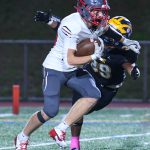 Mount Si High junior Max Castagnola runs the ball while Bellevue Highs sophomore Brogan Gallager tackles him. Photo courtesy of Stephanie Ault Justus