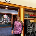 North Bend librarian Lindsay Ellsworth stands for a photo in the room where the Lambert House youth group meets monthly. Ellsworth has been a facilitator of the group since its beginning. Photo by Grace Gorenflo/Valley Record