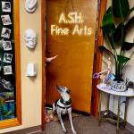 ASH Fine Arts owner Ashley Hale tells her dog to stay for a photo. (Grace Gorenflo/Valley Record)