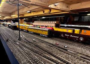 Stationary trains sit on the tracks of the Pacific West Rail display, including models of trains from Great Northern, Union Pacific and Southern Pacific rail companies. (Grace Gorenflo/Valley Record)