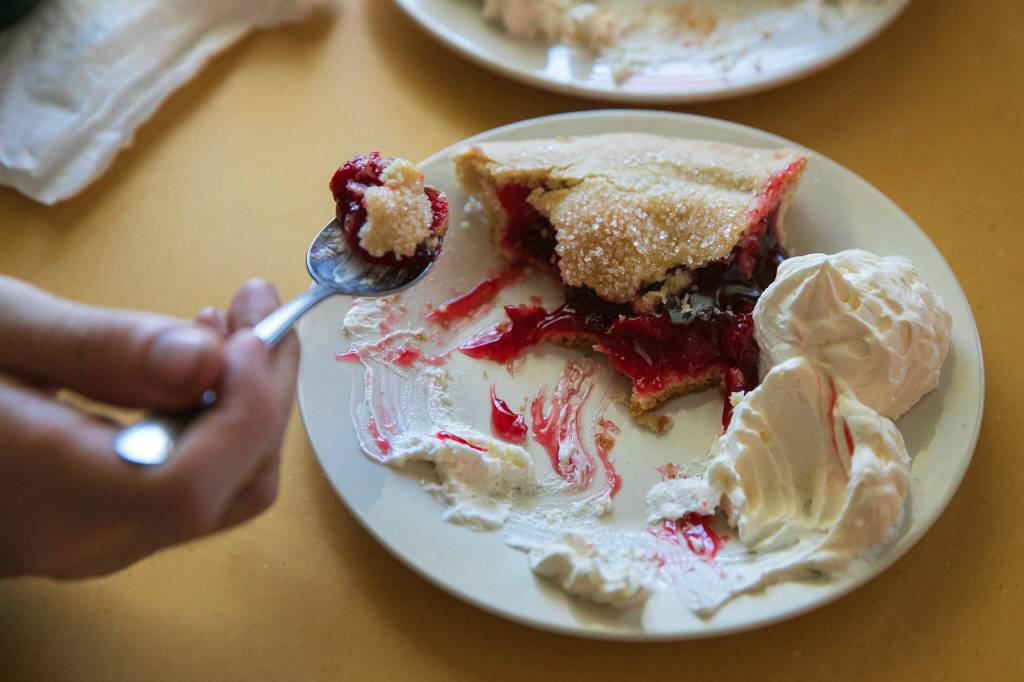 A pair of diners split some cherry pie, the most popular item at Twedes Cafe in North Bend. (Ryan Berry / Sound Publishing)