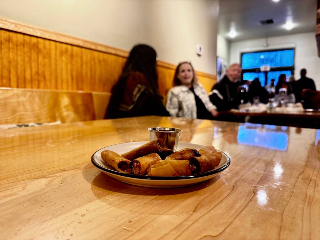 A plate of lumpia  Filipino fried spring rolls  served with chili sauce at the opening of Cories Cafe Nov. 22, 2024. (Grace Gorenflo/Valley Record)