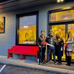 Owner of Cories Cafe Corie Goodloe stands for a photo with friends and family at the opening of her new restaurant, Nov. 22, 2024. (Grace Gorenflo/Valley Record)