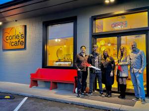 Owner of Cories Cafe Corie Goodloe stands for a photo with friends and family at the opening of her new restaurant, Nov. 22, 2024. (Grace Gorenflo/Valley Record)