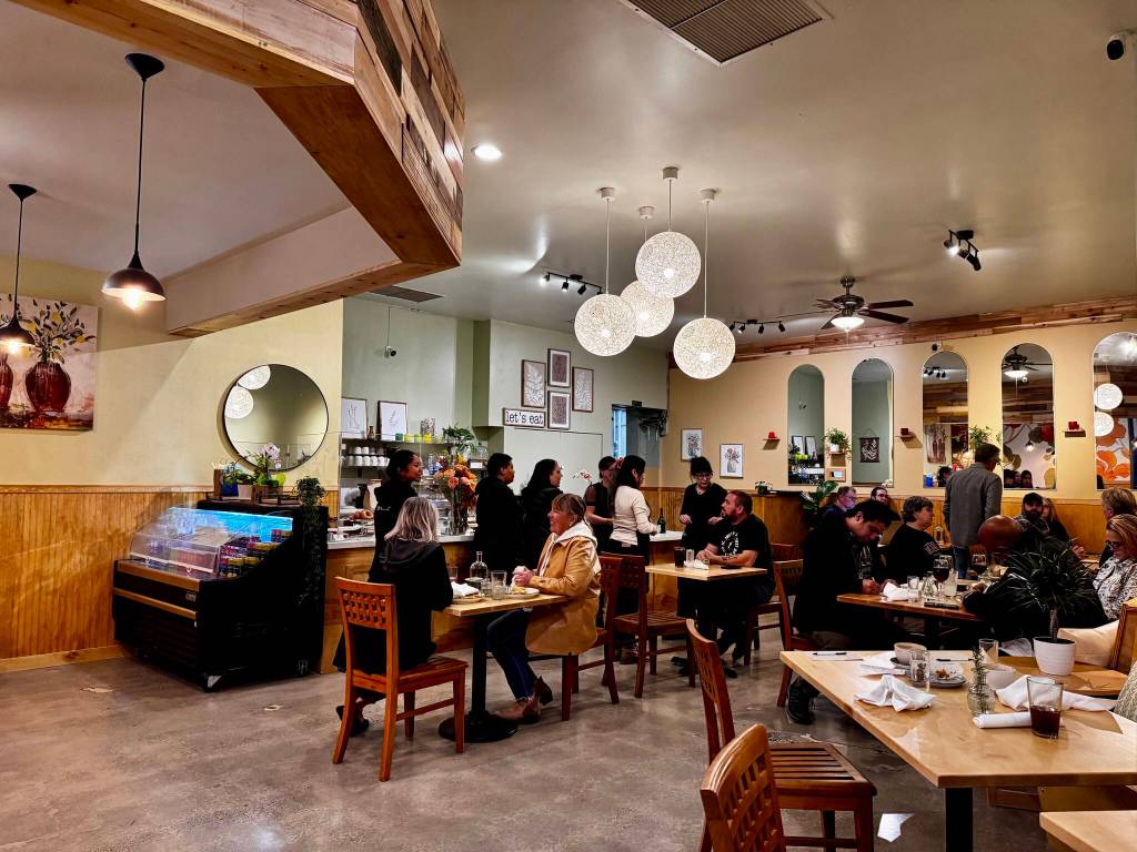Guests enjoy food and drinks at the opening of Cories Cafe, Nov. 22, 2024. (Grace Gorenflo/Valley Record)