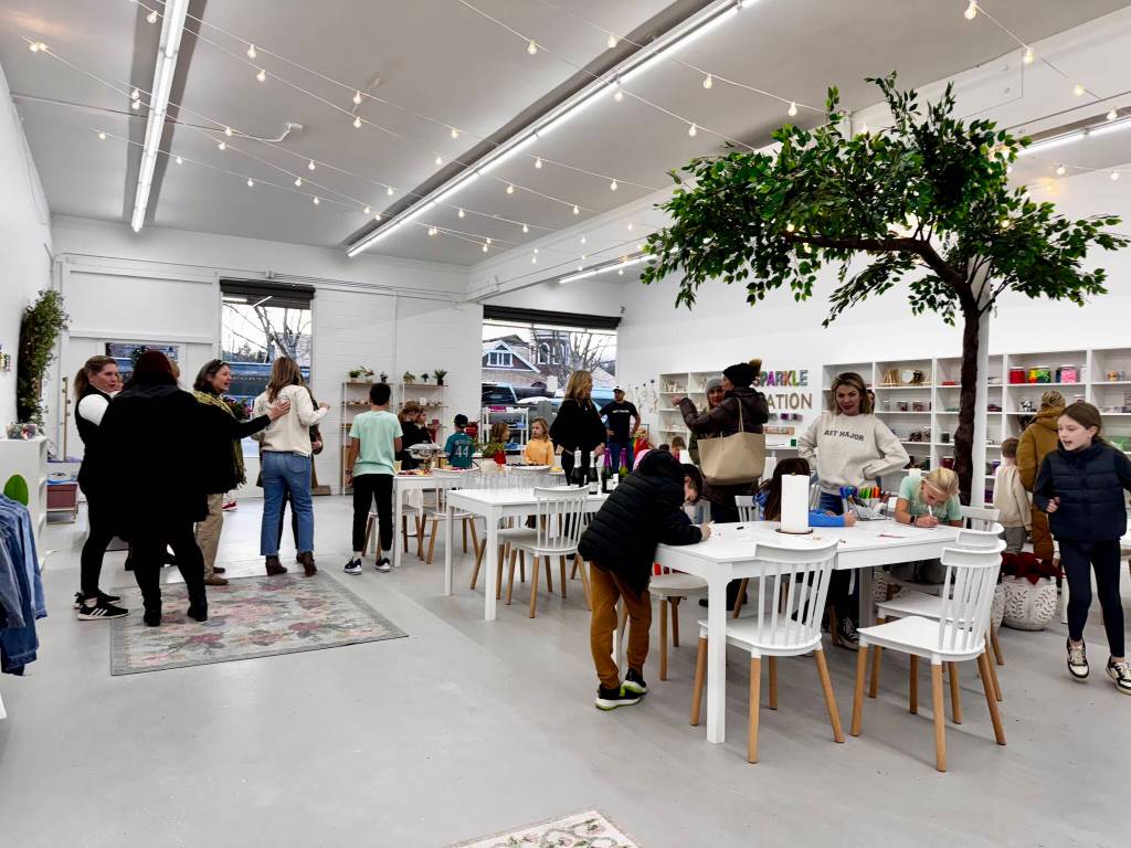Friends, family and neighbors gather to celebrate the opening of the Snoqualmie location of Art Major Studios Dec. 5, 2024. (Grace Gorenflo/Valley Record)