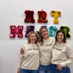 Anne Williams, owner of the Snoqualmie Art Major Studios location, stands for a photo at her grand opening Dec. 5, 2024, with Art Major Studios founder Allie Kingsley Baker (left) and owner of the Art Major Studios Colorado location McKenna Aslin (right). (Grace Gorenflo/Valley Record)