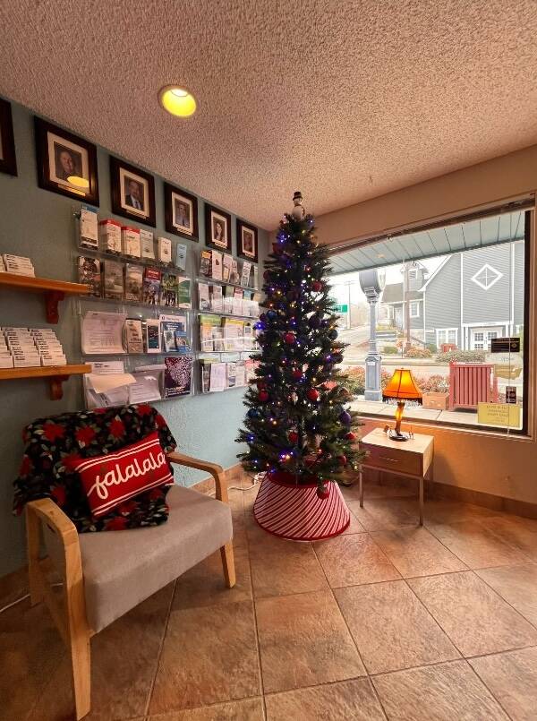 The city of Duvalls holiday windowscape includes a Christmas tree and an A Christmas Story leg lamp.