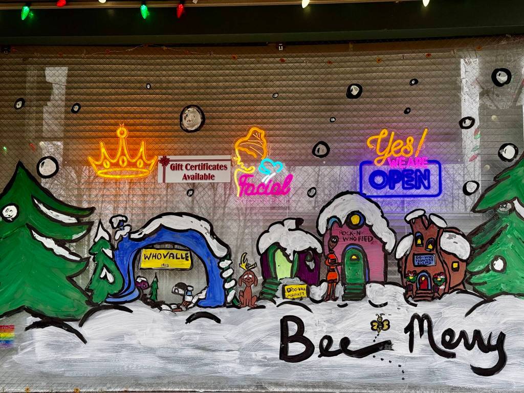 Queen Bee Estheticss holiday windowscape includes a Duvall-themed take on the town of Whoville from The Grinch.