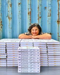 Chef Renee Erickson with copies of her new book Sunlight and Breadcrumbs. Photo courtesy of Eric Tra