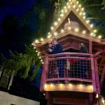 Pete Nelson, joined by his wife, Judy Nelson, speaks to the crowd at the grand opening of Petes Treefort Dec. 7, 2024. (Grace Gorenflo/Valley Record)