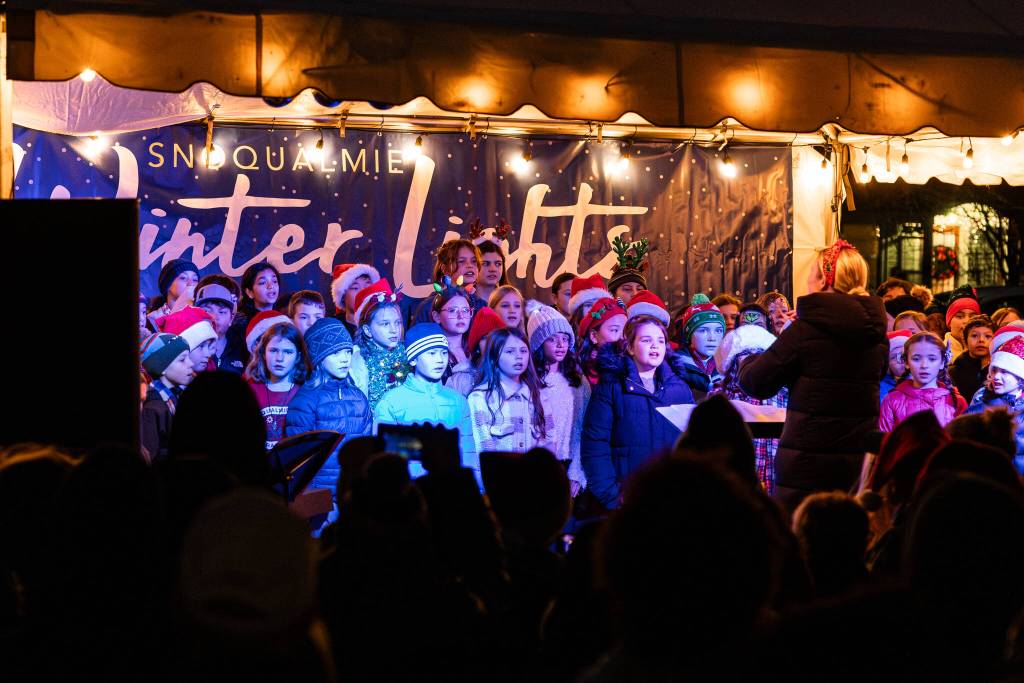 A choir performs at the Snoqualmie Winter Lights celebration on December 7, 2024, in Snoqualmie, Washington.