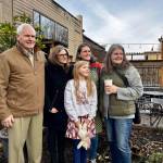 The family of Maggi Whitaker stands for a photo after being gifted Down to Earths new bird bath. From left: Bill Whitaker, Ann Marie Whitaker, Violet Friedel, Jenny Whitaker and Alice Friedel. (Grace Gorenflo/Valley Record)