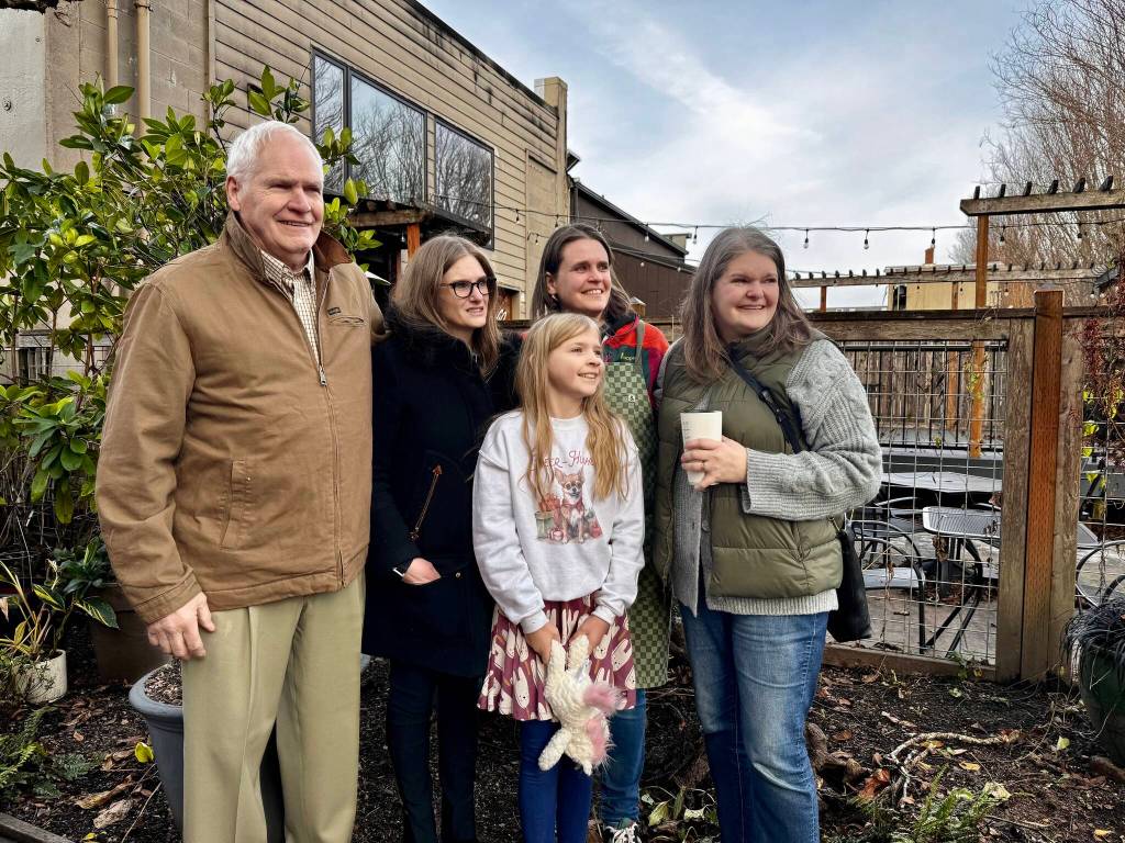 The family of Maggi Whitaker stands for a photo after being gifted Down to Earths new bird bath. From left: Bill Whitaker, Ann Marie Whitaker, Violet Friedel, Jenny Whitaker and Alice Friedel. (Grace Gorenflo/Valley Record)