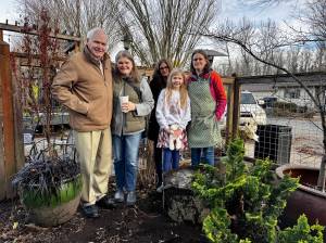 The family of Maggi Whitaker stands for a photo with Down to Earths new bird bath. From left: Bill Whitaker Alice Friedel, Ann Marie Whitaker, Violet Friedel and Jenny Whitaker. (Grace Gorenflo/Valley Record)