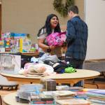 Student volunteers organize toys at the 2024 Giving Tree shop. Photo courtesy of Carolyn Malcolm