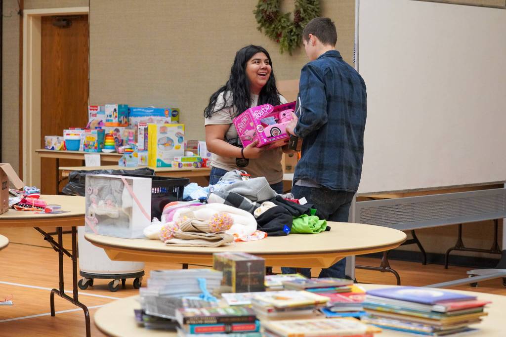 Student volunteers organize toys at the 2024 Giving Tree shop. Photo courtesy of Carolyn Malcolm