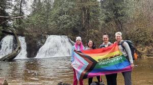 Attendees of a Queer Mountaineers hike at Cherry Creek Falls in Duvall in 2024. Photo courtesy of Queer Mountaineers