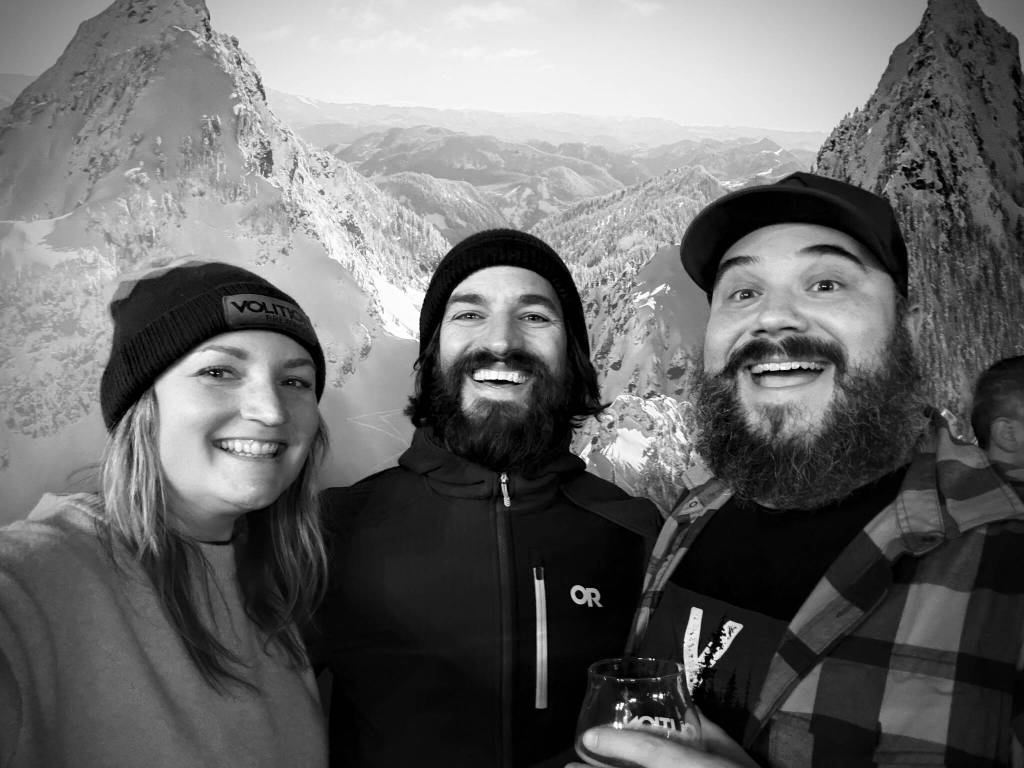 (From left) Jamie Haines, Scott Rinckenberger and Lucas Haines pose for a photo with the new mural at Volition Brewing Co. Photo courtesy of Jaime Haines
