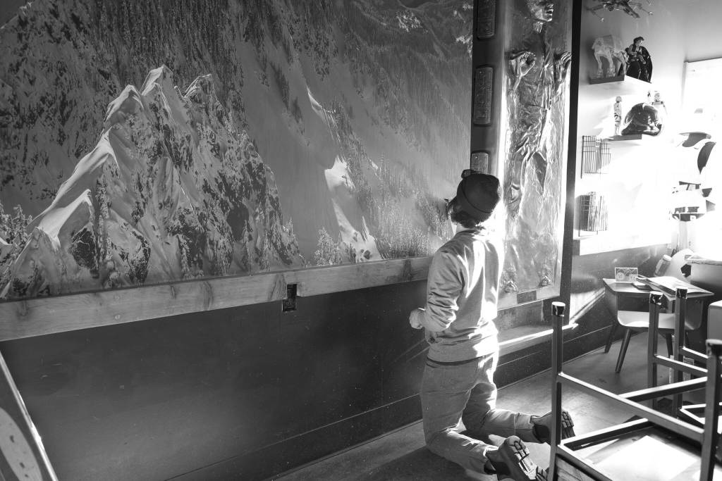 Scott Rinckenberger installs his photo mural at Volition Brewing Co. Photo courtesy of Scott Rinckenberger