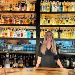 Marta Rothnie, owner of Anejo Tequila Bar, stands for a photo behind the bar Jan. 31, 2025. (Grace Gorenflo/Valley Record)