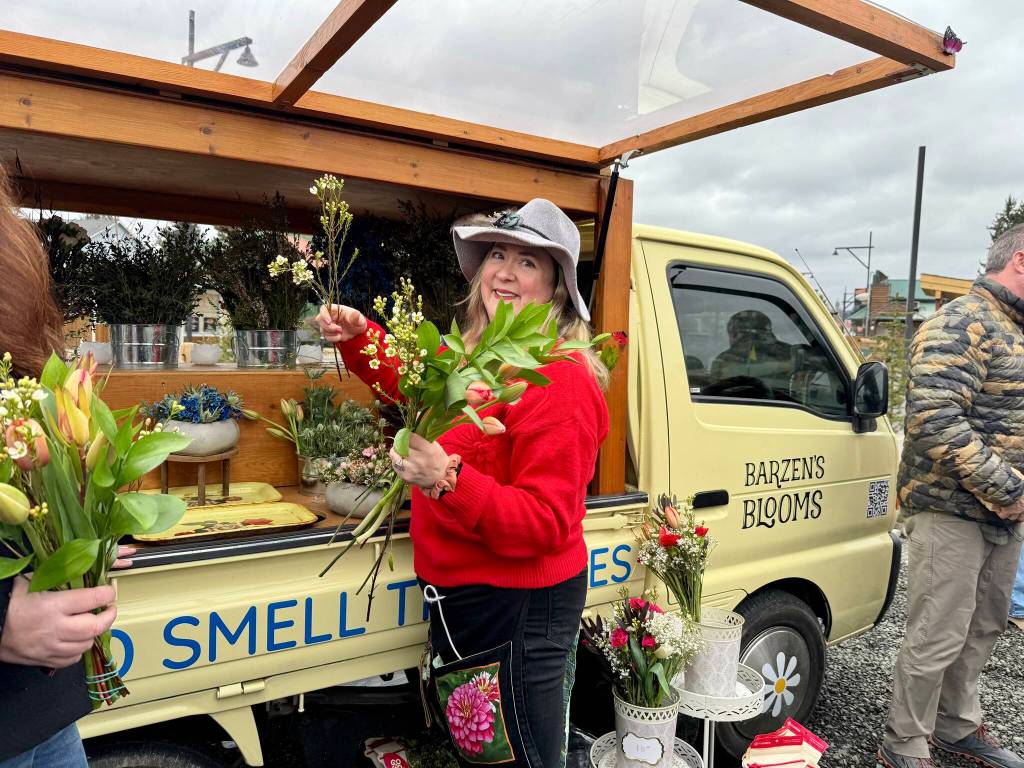 Erin Barzen, owner of Barzens Blooms, crafts floral arrangements at her ribbon cutting ceremony, Feb. 14, 2025. Grace Gorenflo/Valley Record
