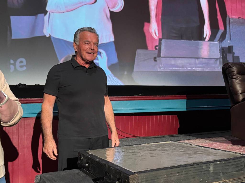 Actor Ray Wise, who played Leland Palmer in Twin Peaks, stands before a crowd at the North Bend Theatre, Feb. 22, 2025. (Grace Gorenflo/Valley Record)