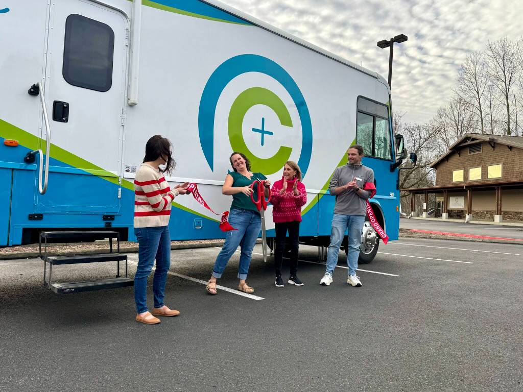 CarePoint Executive Director Misty Messer cuts the ribbon at the opening of CarePoints mobile unit, Feb. 26, 2025. From left: Andrea Pitman, CarePoint clinic manager; Messer; Darcy Dinwiddie, Carnation Chamber of Commerce director; Todd Wright, CarePoint medical director. (Grace Gorenflo/Valley Record)