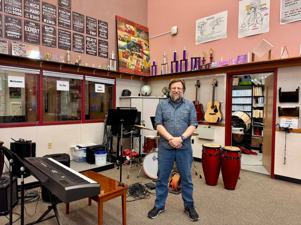 Dean Snavely, Cedarcrest High School music director, stands for a photo in the schools music room, Feb. 25, 2025. (Grace Gorenflo/Valley Record)