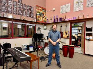 Dean Snavely, Cedarcrest High School music director, stands for a photo in the schools music room, Feb. 25, 2025. (Grace Gorenflo/Valley Record)