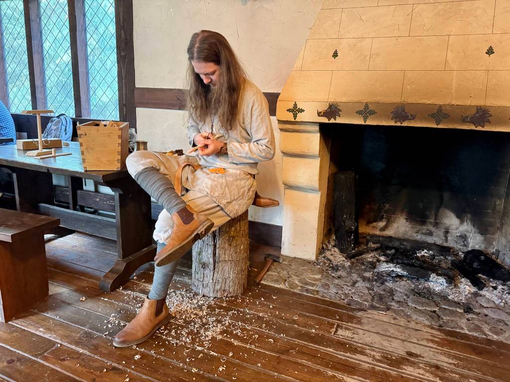A Camlann volunteer whittles wood into spoons inside the Bors Hede restaurant, March 9, 2025. Grace Gorenflo/Valley Record