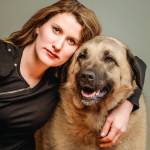 Beyond the Stables owner Christina Lathrop poses for a portrait with her dog. Photo courtesy of Christina Lathrop/Beyond the Stables photography