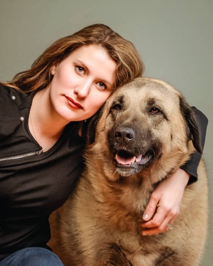 Beyond the Stables owner Christina Lathrop poses for a portrait with her dog. Photo courtesy of Christina Lathrop/Beyond the Stables photography