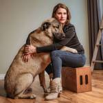 Beyond the Stables owner Christina Lathrop poses for a portrait with her dog. Photo courtesy of Christina Lathrop/Beyond the Stables photography