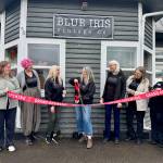 Blue Iris Vintage Co. owner Jessica Miller prepares to cut the ribbon, surrounded by friends and shop vendors, at her shops ceremony March 22, 2025. Photos by Grace Gorenflo/Valley Record