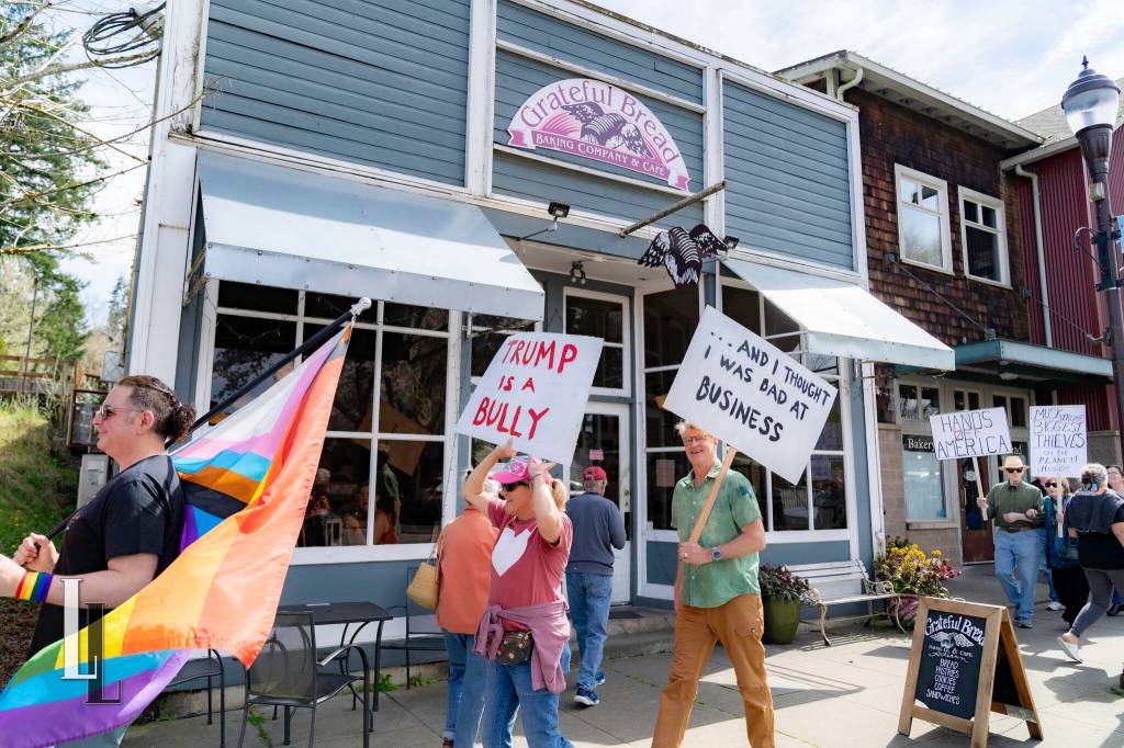 Marchers walk through downtown Duvall during the Hands Off! protest April 5, 2025. Photo courtesy of Travis Wetherbee/Last Lite Photography