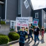 Marchers walk through downtown Duvall during the Hands Off! protest April 5, 2025. Photo courtesy of Travis Wetherbee/Last Lite Photography
